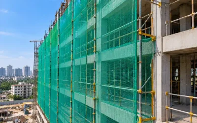 Vertical safety nets on high-rise construction scaffolding