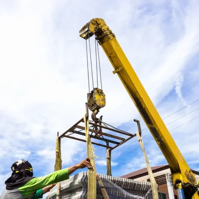 construction-site-men-working-crane-load-tile-roof-building construction-site-men-working-crane-load-tile-roof-building