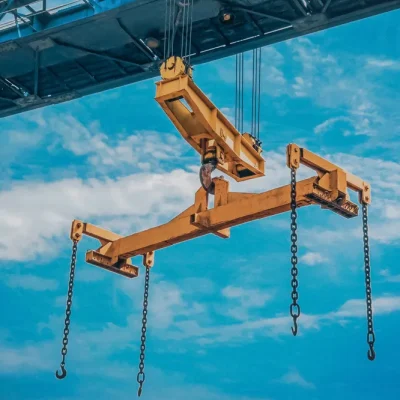 crane-moves-reinforced-metal-product-with-hooks-yellow-crane-beam-blue-sky-background crane-moves-reinforced-metal-product-with-hooks-yellow-crane-beam-blue-sky-background