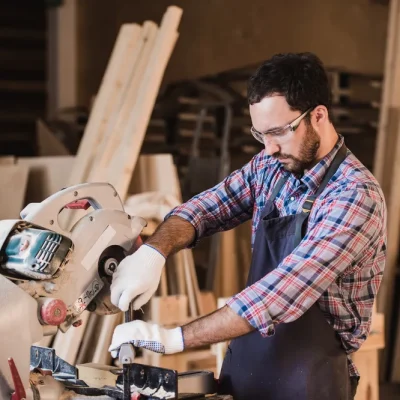 framing-contractor-using-circular-cut-off-saw-trim-wood-studs-length framing-contractor-using-circular-cut-off-saw-trim-wood-studs-length